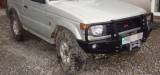 Передній бампер для Pajero II 1991-1999 (версія з пластиковими розширювачами арок) без кенгурятника