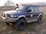 Передній бампер для Pajero SPORT (1996-2000г) (версія перед рестайлінгом, тобто з поворотниками в бампері) з плитою під лебідку і кенгурятником